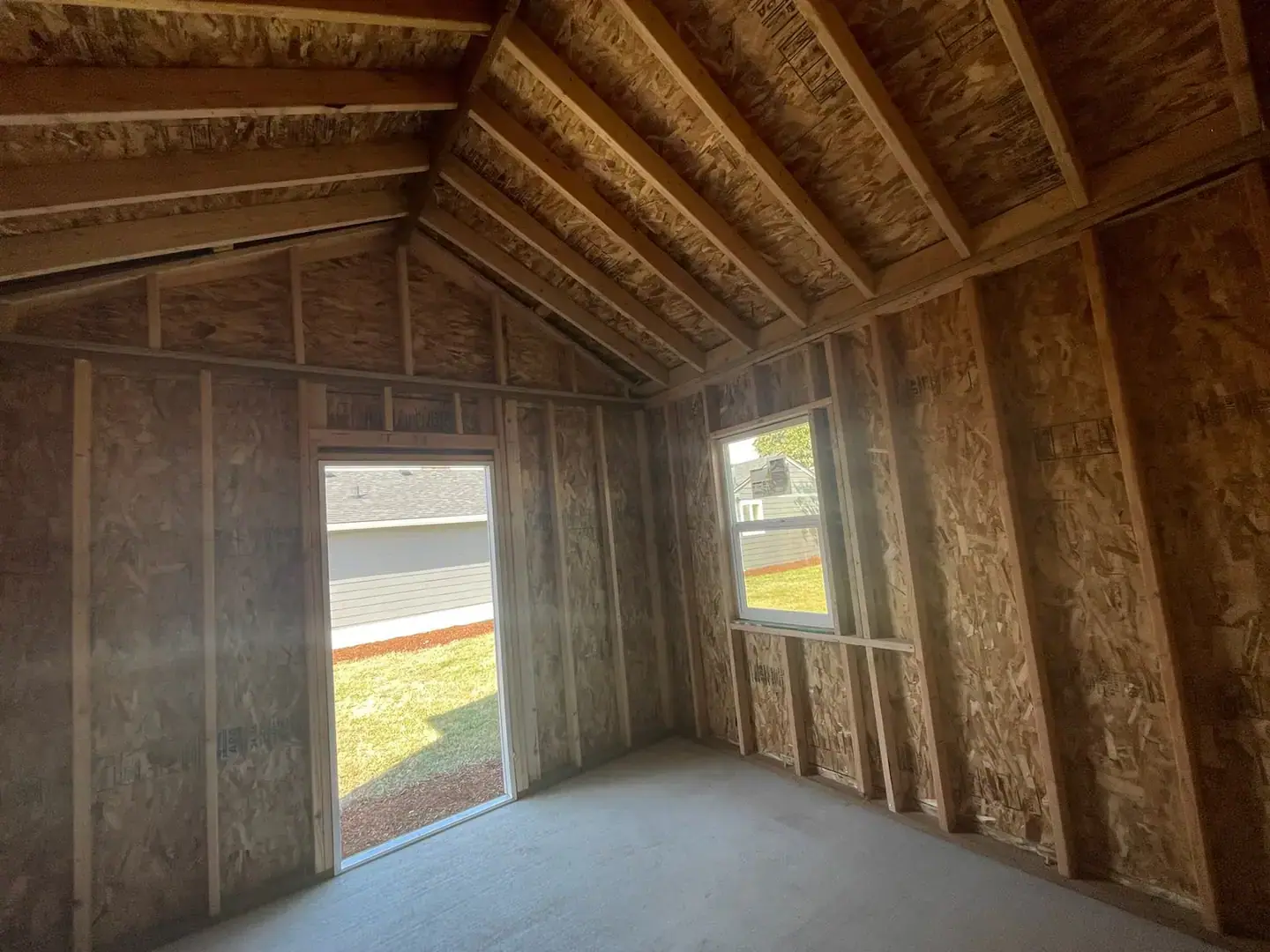 Vaulted ceiling framing inside a new backyard structure built by VMG